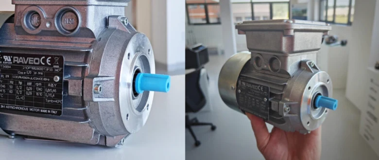 Asynchronní elektromotor s modrým hřídelem v ruce.