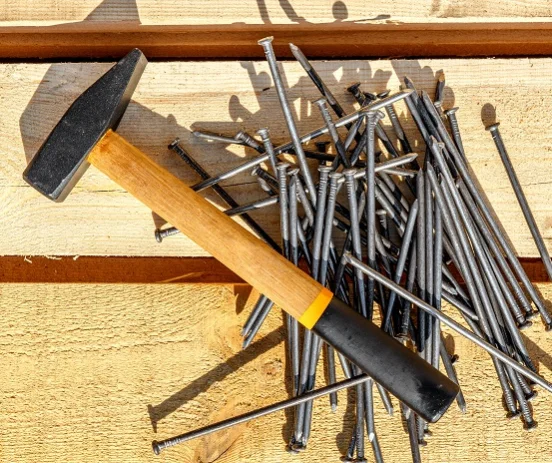 Hammer and nails on wood