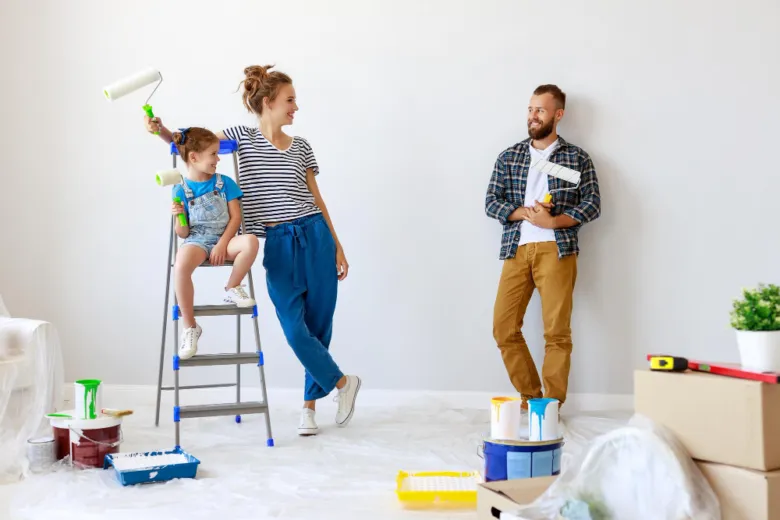 Family painting walls together