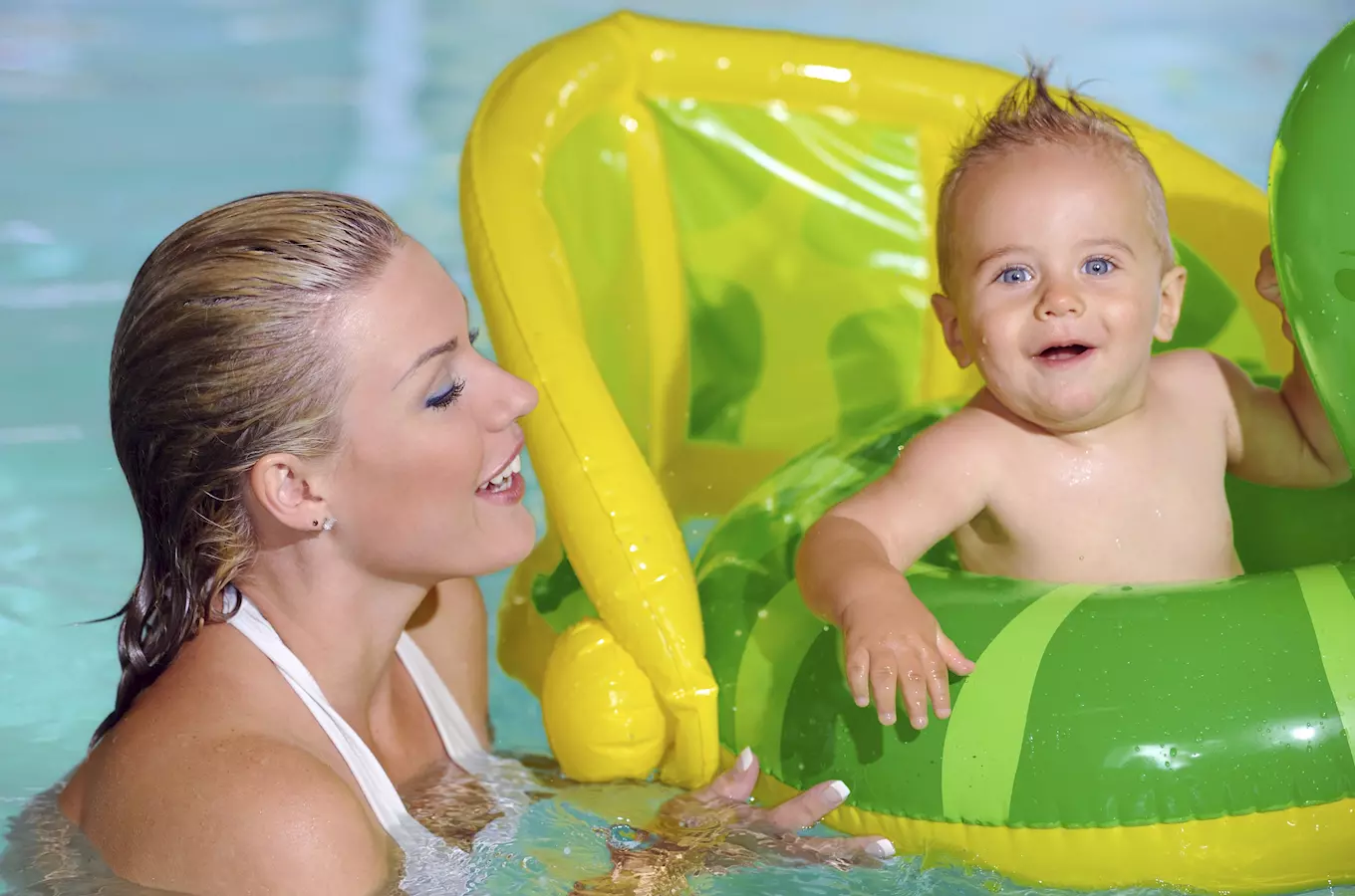 Woman and baby in pool