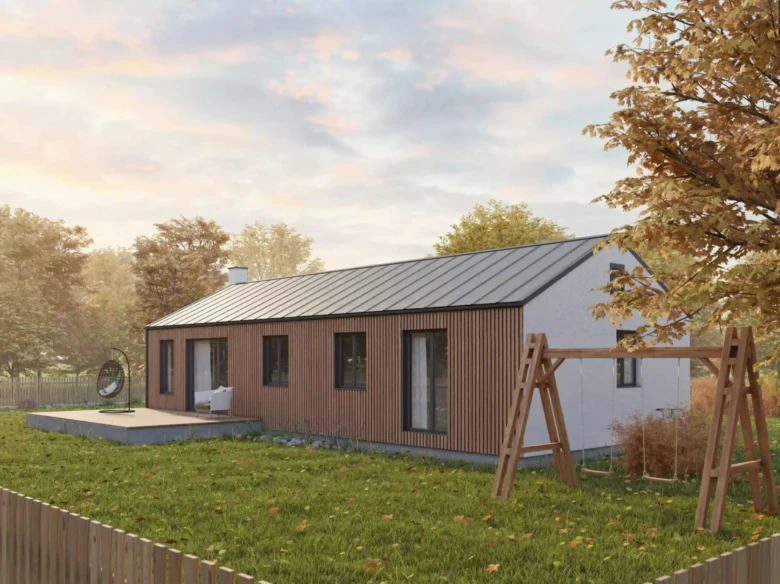 Moderní modulový dům s dřevěnou fasádou na trávníku.