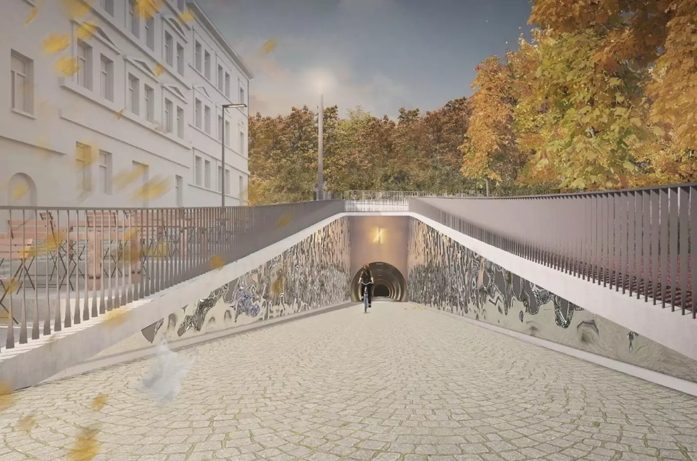 Podjezdní tunel s cyklistou v Praze pod chodníkem.