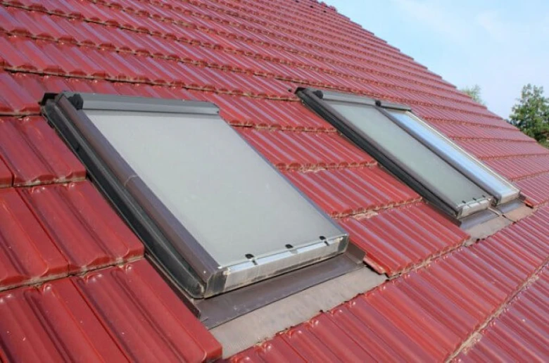 Roof windows with external shutters