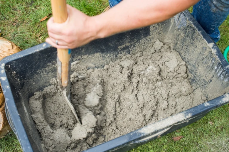 Mixing concrete in wheelbarrow