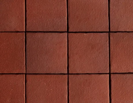Červené cihlové dlaždice na podlaze nebo zeď.