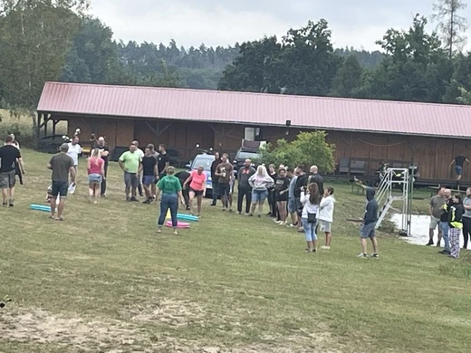 Group at campsite building