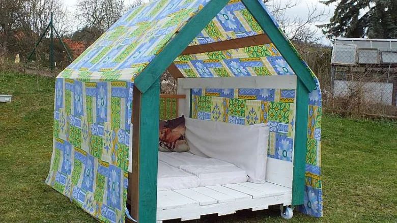 Pallet playhouse with bed inside