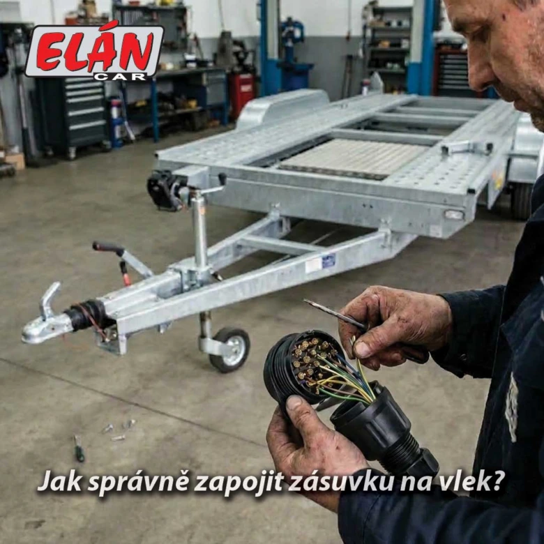 Muž zapojuje elektrickou zásuvku na přívěsovém vozidle v dílně.