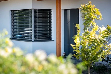 Exterior window shutters on house wall