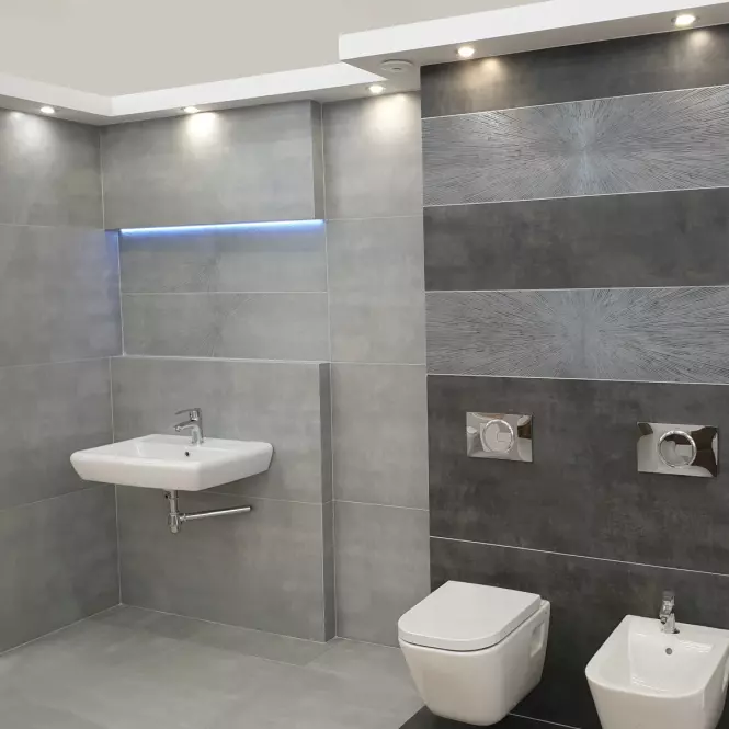 Moderní koupelna s velkými šedými obklady na stěnách.